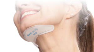 Emface applicator placed beneath a woman's chin.